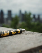 Steamulation goldl leaf carbon mouthpiece on a ledge overlooking the city at Montreal lookouts
